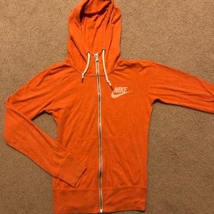 Orange Nike zip up